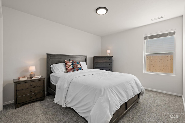 carpeted bedroom with baseboards and visible vents