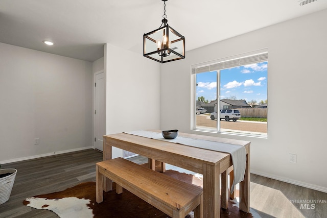 dining room featuring recessed lighting, wood finished floors, baseboards, visible vents, and a notable chandelier