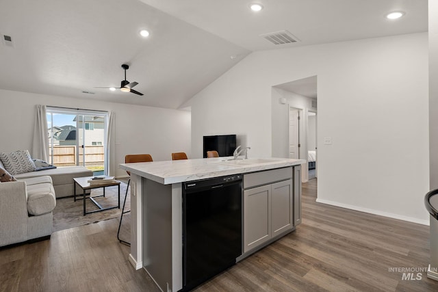 kitchen with light countertops, dishwasher, a sink, visible vents, and open floor plan
