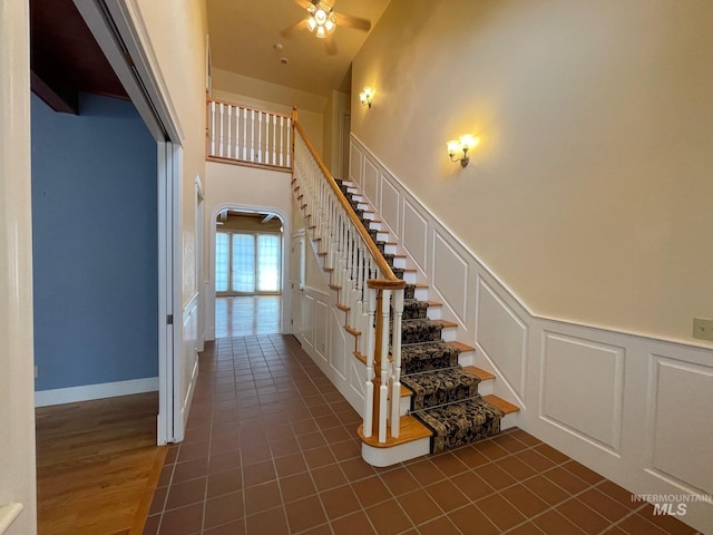 staircase with tile patterned floors