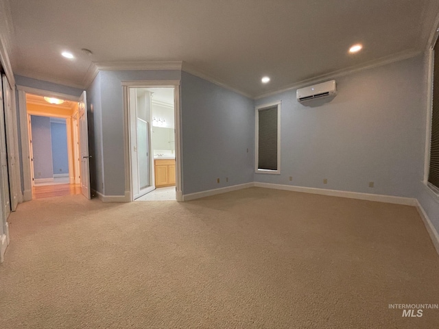 spare room featuring ornamental molding, a wall mounted air conditioner, and light colored carpet