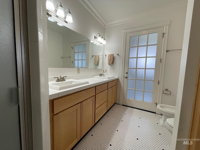 bathroom featuring a bidet, tile patterned flooring, toilet, vanity, and crown molding