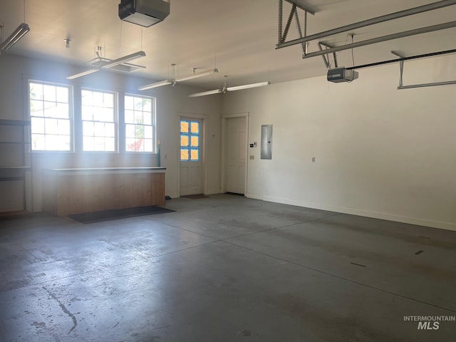 garage featuring a garage door opener and electric panel