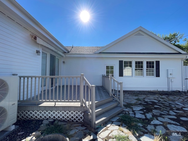 rear view of house with a wooden deck