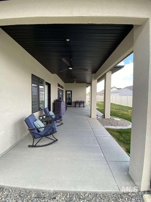 view of patio / terrace featuring ceiling fan