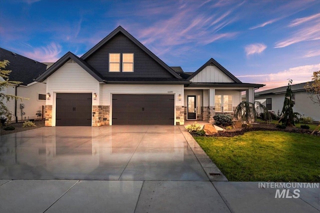 craftsman-style home with a lawn and a garage