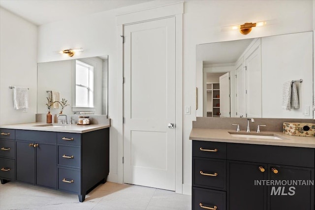 bathroom featuring tile patterned floors and vanity