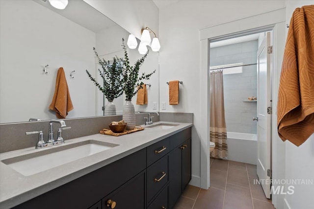 full bathroom featuring shower / tub combo, tile patterned flooring, vanity, and toilet