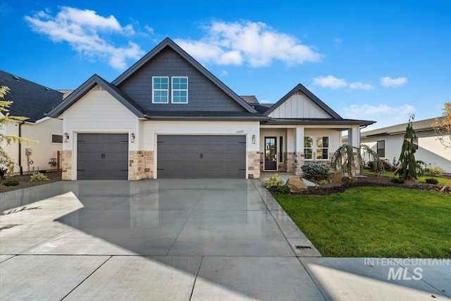 craftsman house with a porch, a front yard, and a garage