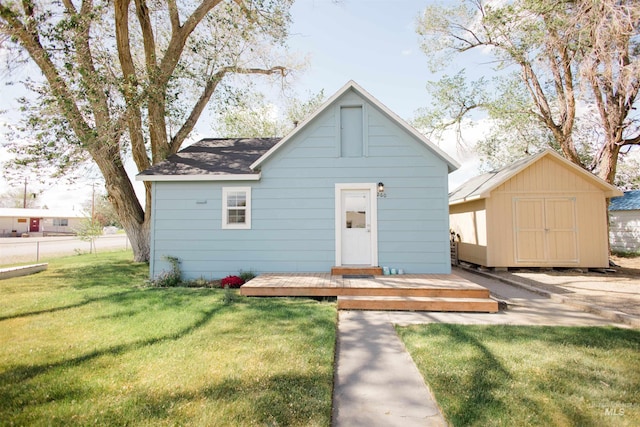 260 State St, Grand View, ID 83624 - view of front of property featuring an outbuilding, a storage unit, and a front yard