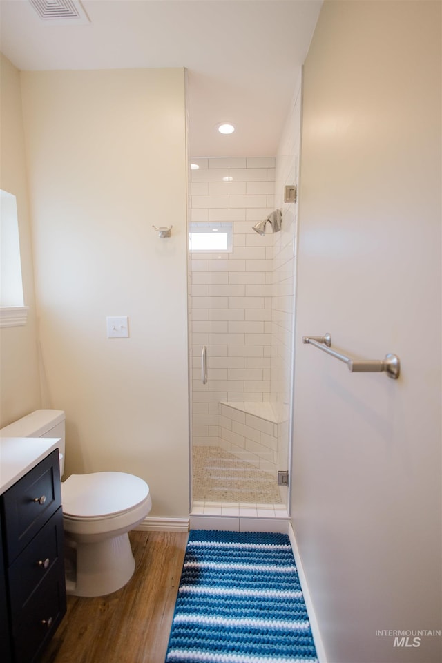 260 State St, Grand View, ID 83624 - bathroom featuring a stall shower, toilet, baseboards, wood finished floors, and recessed lighting