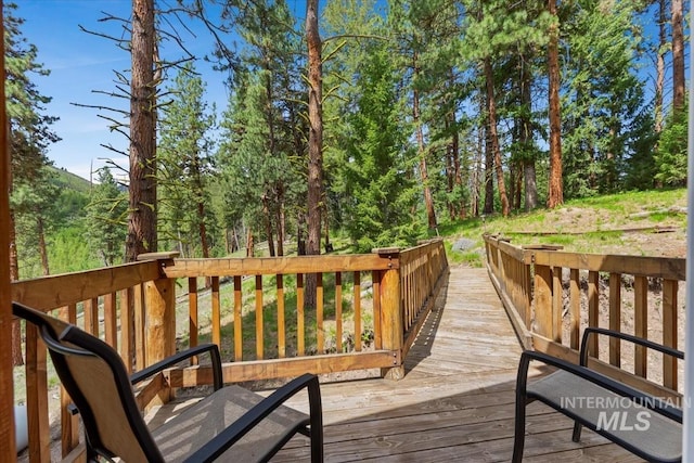 150 W Yuba Vista Dr, Atlanta, ID 83716 - wooden deck featuring a forest view