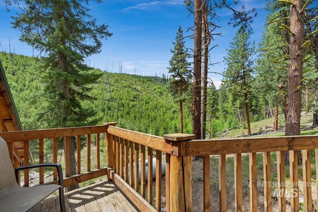 150 W Yuba Vista Dr, Atlanta, ID 83716 - wooden deck featuring a forest view