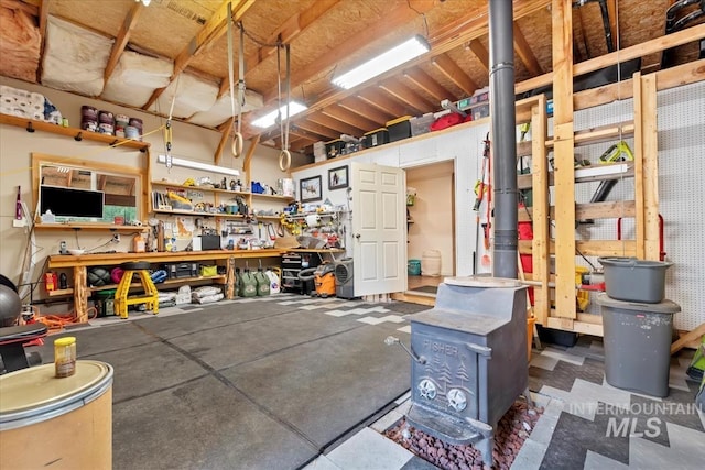 150 W Yuba Vista Dr, Atlanta, ID 83716 - garage featuring a workshop area and a wood stove