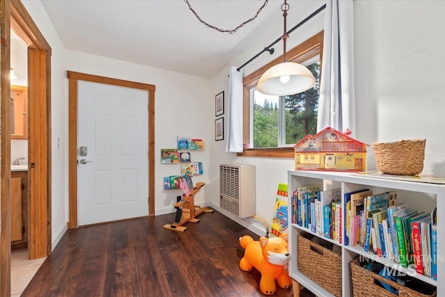 150 W Yuba Vista Dr, Atlanta, ID 83716 - playroom with wood finished floors, heating unit, and baseboards