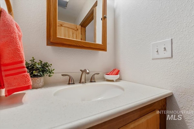 150 W Yuba Vista Dr, Atlanta, ID 83716 - bathroom featuring vanity and a textured wall