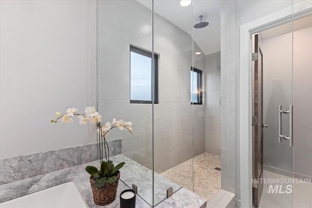 bathroom featuring an enclosed shower