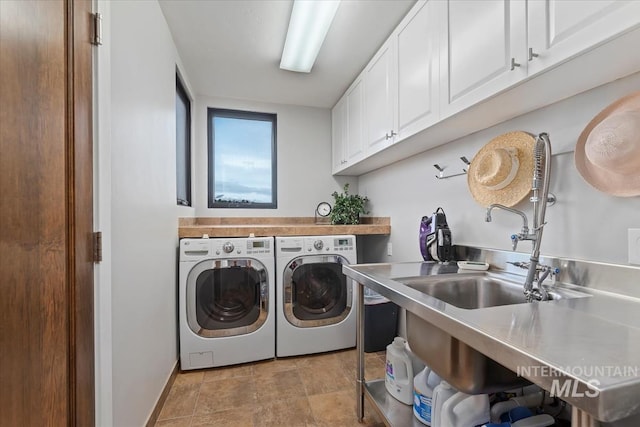 laundry room featuring cabinets and independent washer and dryer