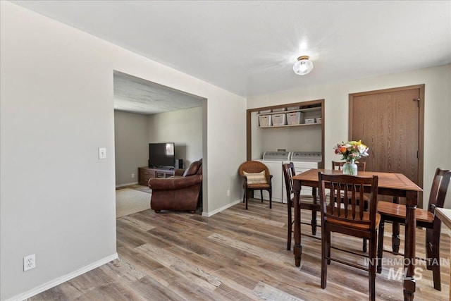 131 Goodall Pl, Mountain Home, ID 83647 - dining space featuring light wood finished floors, baseboards, and separate washer and dryer