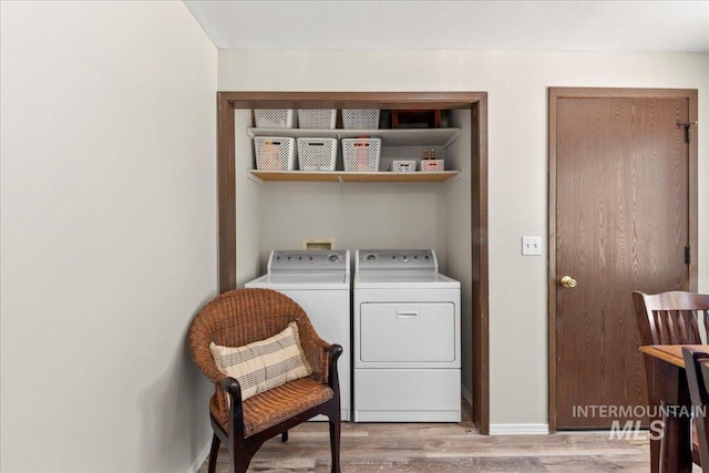 131 Goodall Pl, Mountain Home, ID 83647 - washroom featuring washer and dryer and light wood-type flooring