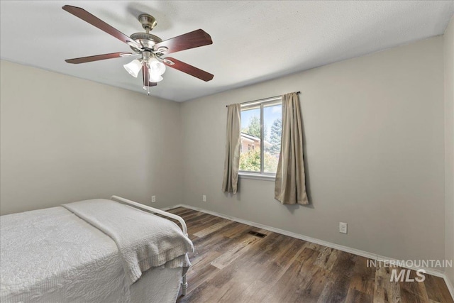 131 Goodall Pl, Mountain Home, ID 83647 - bedroom featuring wood finished floors, baseboards, and ceiling fan