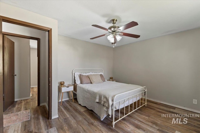 131 Goodall Pl, Mountain Home, ID 83647 - bedroom featuring wood finished floors, baseboards, and a ceiling fan