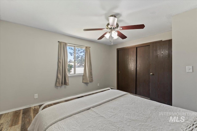 131 Goodall Pl, Mountain Home, ID 83647 - bedroom with wood finished floors, a closet, baseboards, and ceiling fan