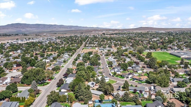 131 Goodall Pl, Mountain Home, ID 83647 - aerial overview of property's location featuring a mountain backdrop and nearby suburban area
