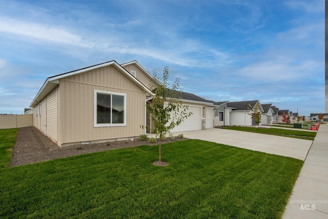 view of front of house with a front yard and a garage