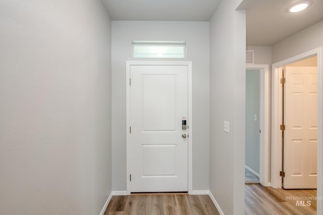 doorway to outside with light hardwood / wood-style floors