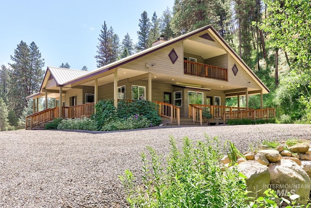 view of front of home with a balcony and covered porch