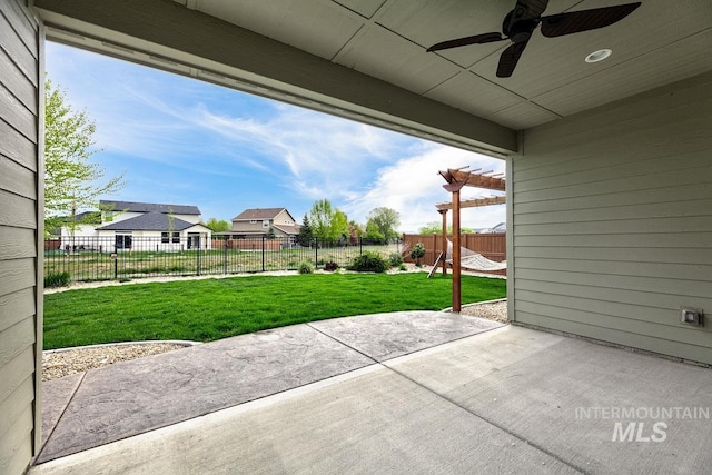 view of patio / terrace with a ceiling fan and a fenced backyard
