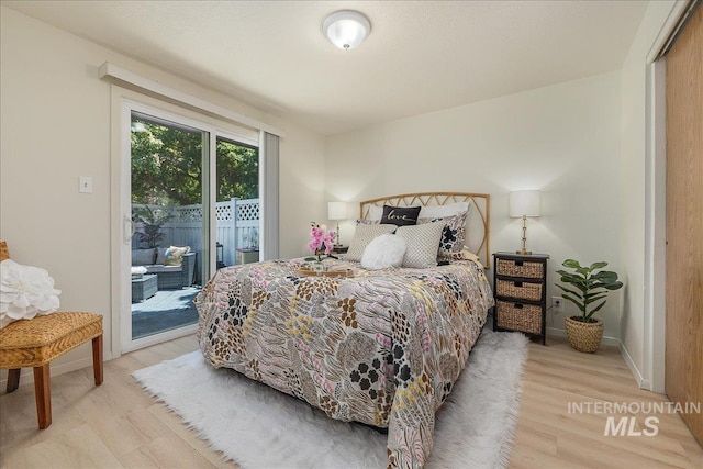498 E Chester Ln, Boise, ID 83706 - bedroom with access to exterior, light wood-style flooring, and baseboards