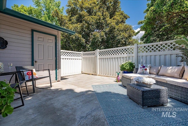 498 E Chester Ln, Boise, ID 83706 - fenced backyard featuring a patio and an outdoor living space