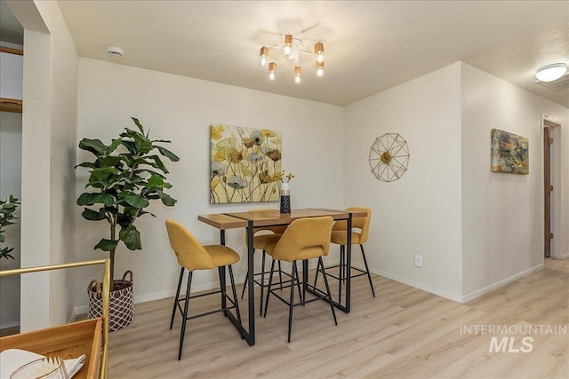 498 E Chester Ln, Boise, ID 83706 - dining room featuring wood finished floors and baseboards