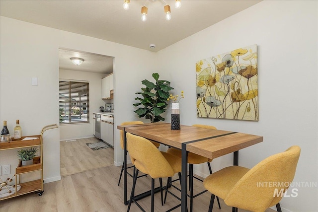 498 E Chester Ln, Boise, ID 83706 - dining space featuring light wood-style flooring and baseboards