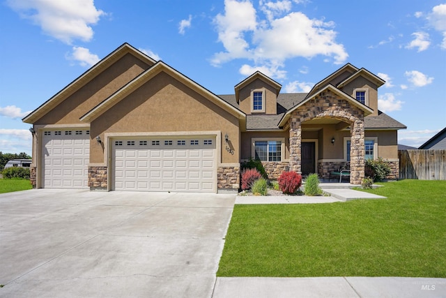 1020 Woodland St, Rupert, ID 83350 - view of front of property with stone siding, stucco siding, an attached garage, and concrete driveway
