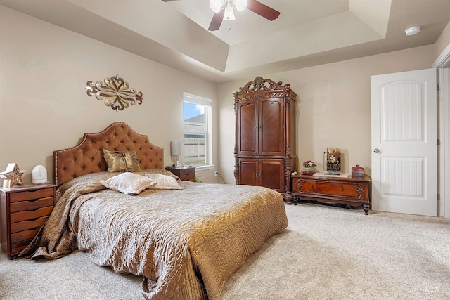 1020 Woodland St, Rupert, ID 83350 - bedroom featuring light colored carpet, a tray ceiling, and a ceiling fan