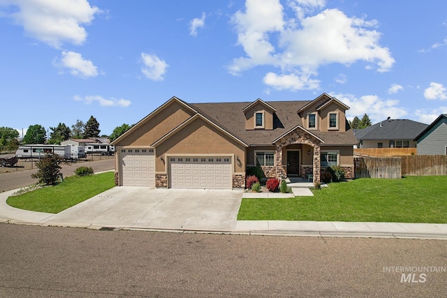 1020 Woodland St, Rupert, ID 83350 - view of front of property with stone siding, stucco siding, a garage, and concrete driveway