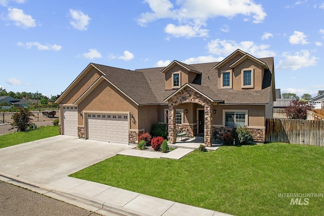 1020 Woodland St, Rupert, ID 83350 - view of front of home with stone siding, stucco siding, and an attached garage