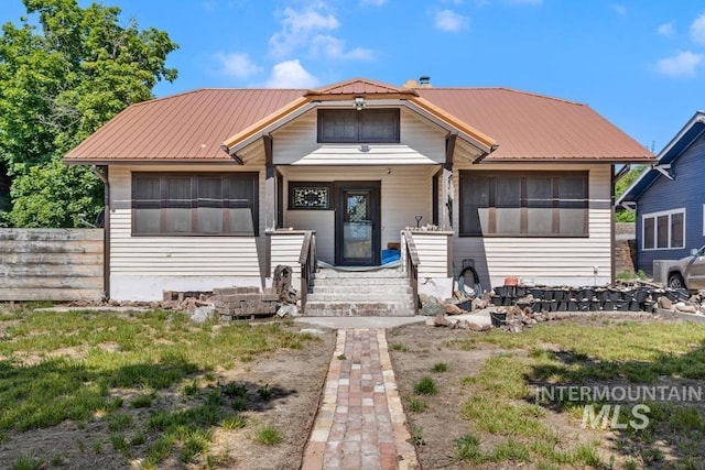 937 SW 1st St, Ontario, OR 97914 - view of front of home featuring a metal roof and covered porch