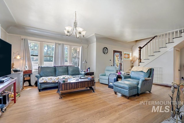 937 SW 1st St, Ontario, OR 97914 - living area featuring a chandelier, healthy amount of natural light, light wood-style floors, and stairs