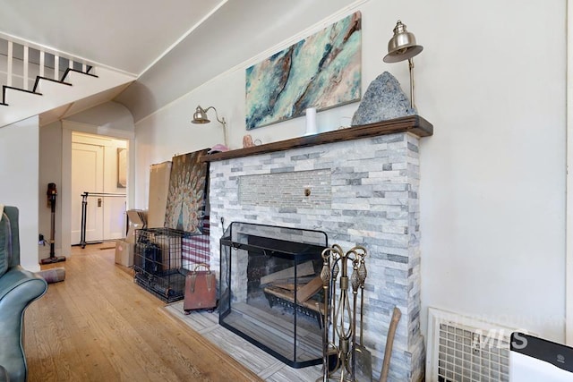 937 SW 1st St, Ontario, OR 97914 - living room featuring wood finished floors, a fireplace, and stairs