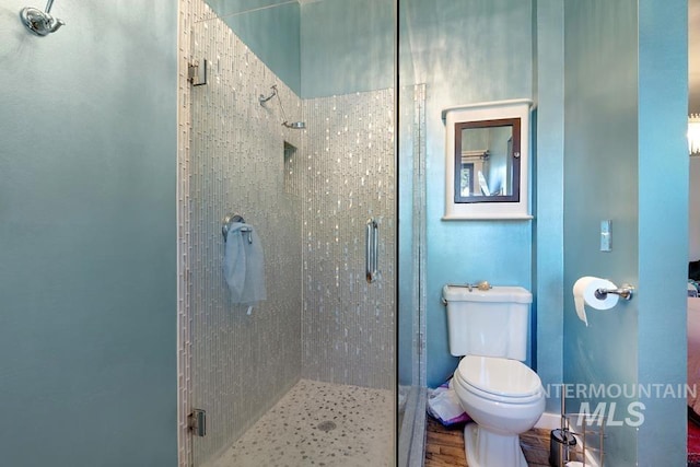937 SW 1st St, Ontario, OR 97914 - bathroom with a shower stall and wood finished floors