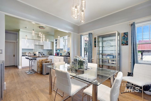 937 SW 1st St, Ontario, OR 97914 - dining space featuring light wood finished floors and a chandelier