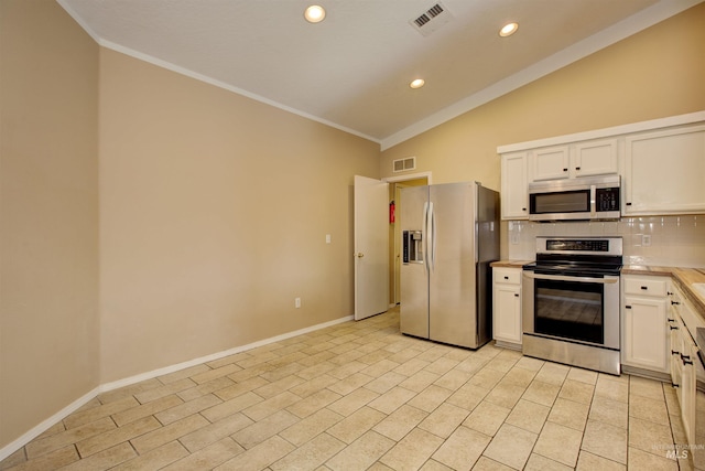 kitchen featuring lofted ceiling, light countertops, visible vents, and appliances with stainless steel finishes