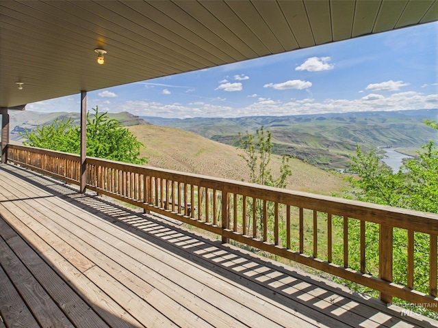 wooden deck featuring a mountain view