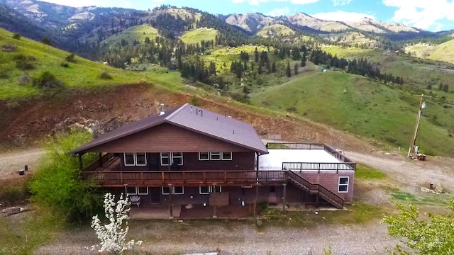 birds eye view of property with a mountain view