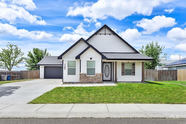 1295 NE Blossom, Mountain Home, ID 83647 - view of front of property with concrete driveway, a garage, and roof with shingles