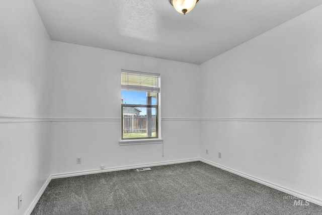 1295 NE Blossom, Mountain Home, ID 83647 - carpeted spare room featuring baseboards and a textured ceiling